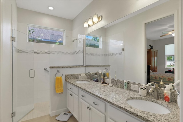 bathroom with vanity, tile patterned floors, an enclosed shower, and ceiling fan