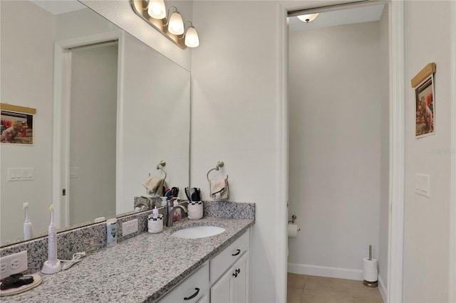 bathroom with tile patterned flooring and vanity