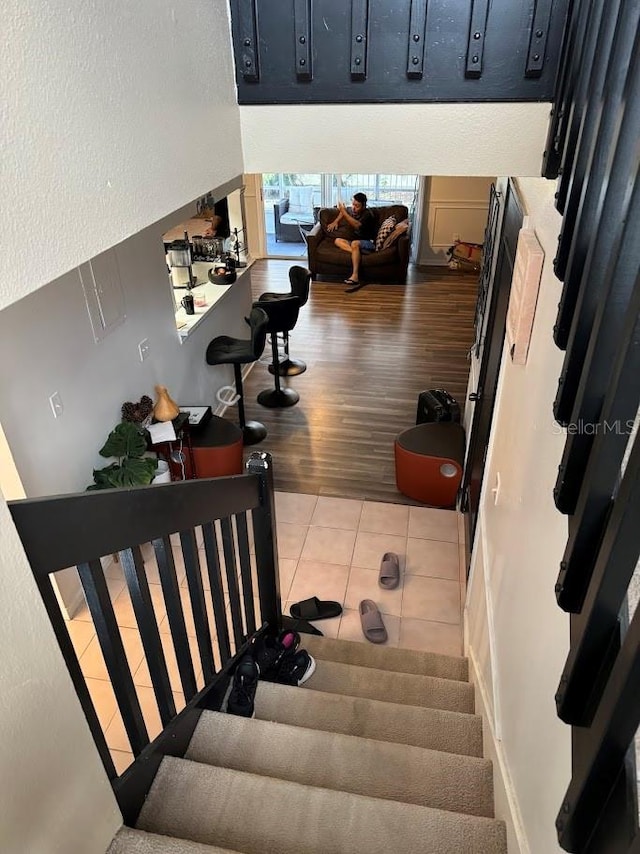 stairway with wood-type flooring and a mail area