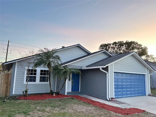 single story home featuring a garage