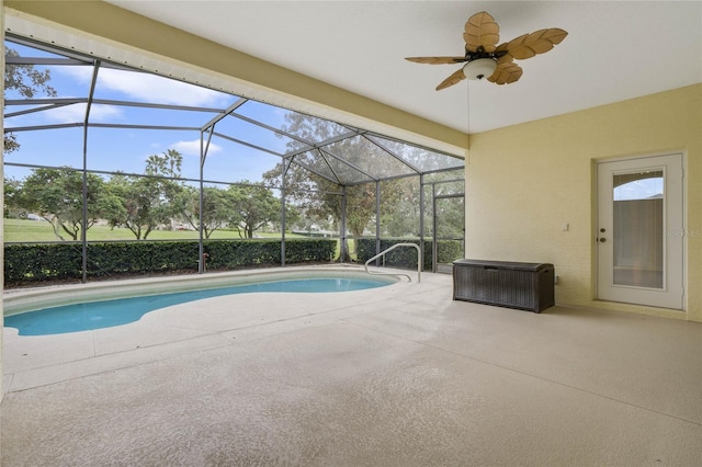 view of swimming pool with a patio area, ceiling fan, and a lanai