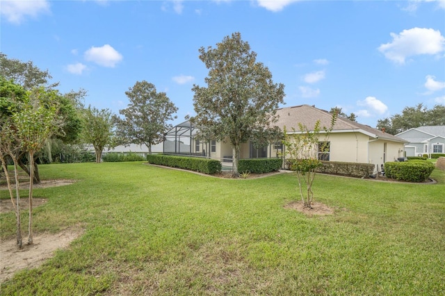 view of yard with a lanai