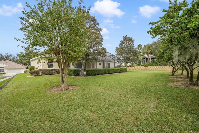 view of yard featuring a lanai