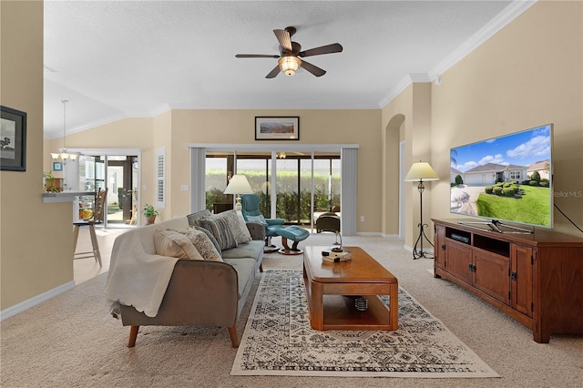 carpeted living room with ceiling fan with notable chandelier, ornamental molding, a textured ceiling, and lofted ceiling