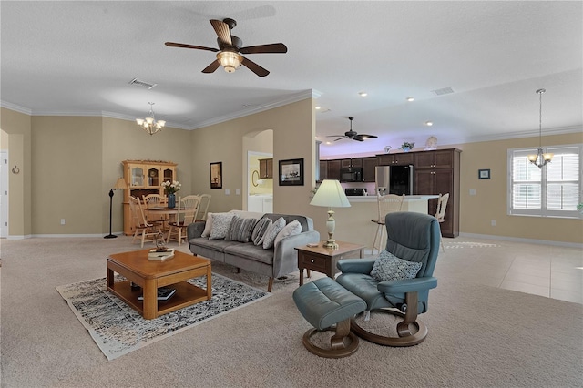 living room featuring a textured ceiling, light carpet, crown molding, and ceiling fan with notable chandelier