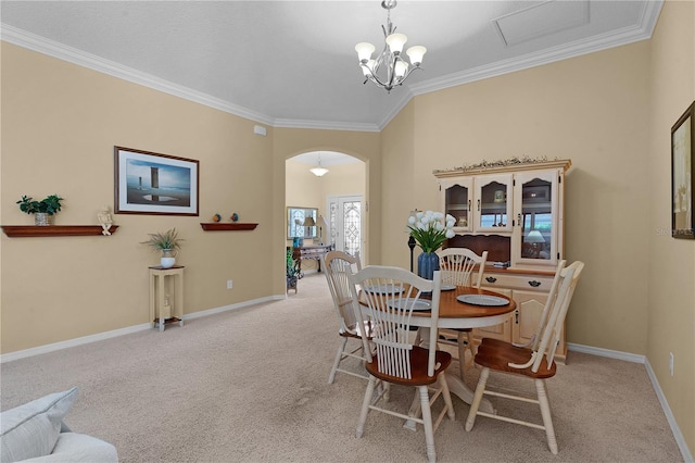 dining space featuring crown molding, light carpet, and a notable chandelier