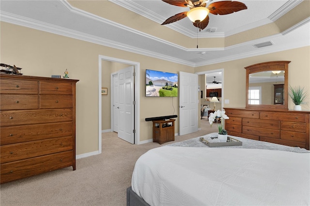 bedroom featuring light carpet, a raised ceiling, ceiling fan, and crown molding