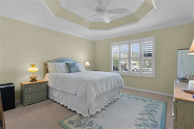 bedroom with light carpet, a raised ceiling, ceiling fan, and crown molding