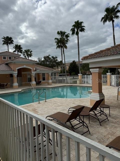 view of swimming pool with a patio