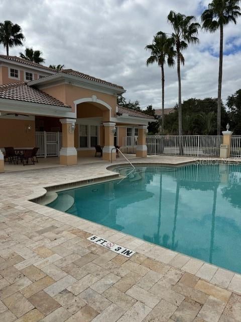 view of swimming pool with a patio