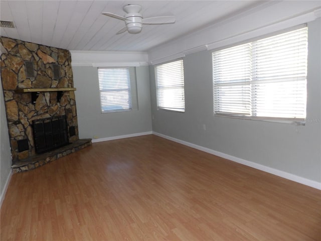 unfurnished living room with hardwood / wood-style floors, ceiling fan, wooden ceiling, and a fireplace