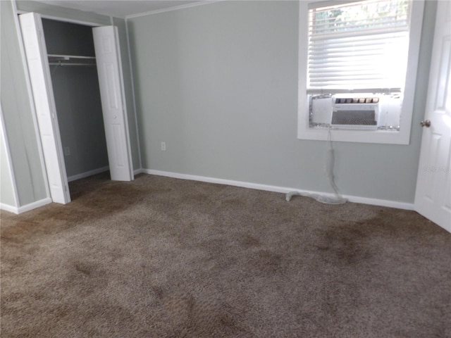 unfurnished bedroom featuring carpet and a closet