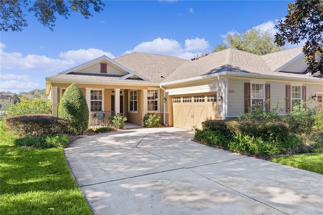 view of front of house featuring covered porch and a garage