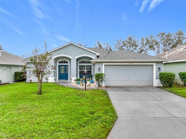 ranch-style home with a garage and a front yard