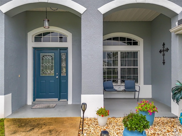 entrance to property with a porch