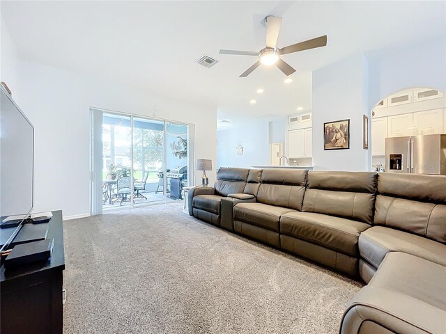 living room featuring ceiling fan and carpet floors