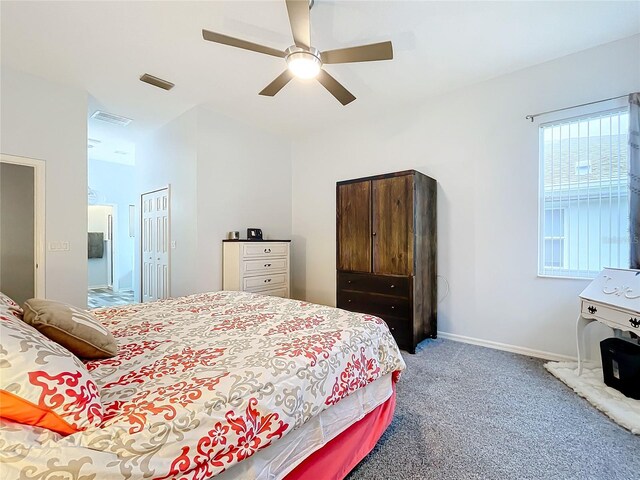 bedroom featuring ceiling fan, carpet floors, and a closet