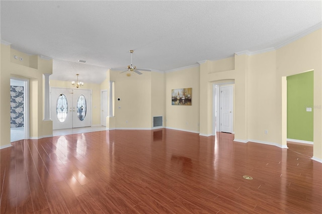 unfurnished living room featuring french doors, crown molding, hardwood / wood-style floors, and a textured ceiling