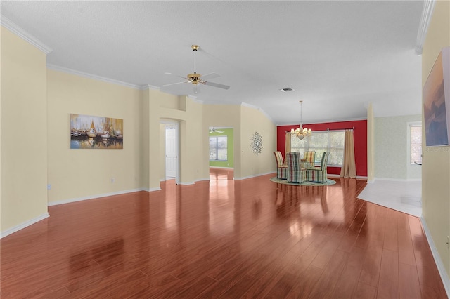 interior space featuring hardwood / wood-style flooring, ceiling fan with notable chandelier, and crown molding