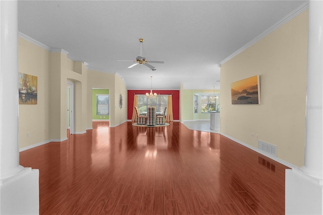 spare room featuring decorative columns, crown molding, wood-type flooring, a textured ceiling, and ceiling fan with notable chandelier