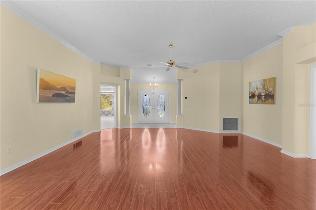 unfurnished living room featuring crown molding, light hardwood / wood-style flooring, and a textured ceiling