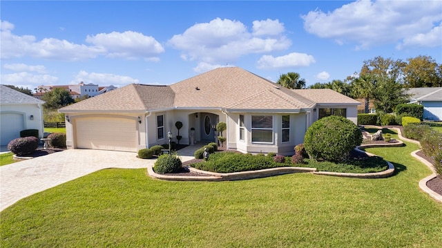 view of front of home featuring a garage and a front lawn