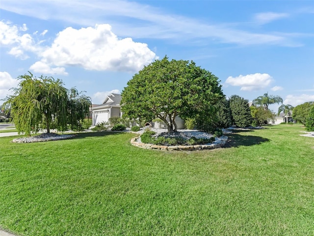 view of yard with a garage