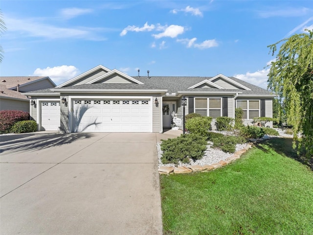 single story home featuring a front yard and a garage