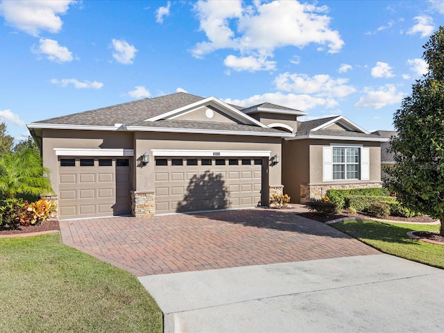 view of front of property featuring a garage and a front yard