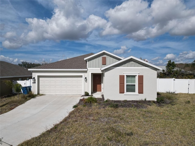 single story home featuring a garage and a front yard