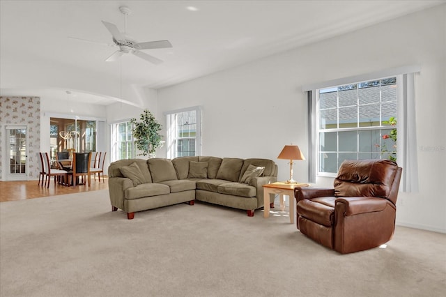 living room featuring ceiling fan and light hardwood / wood-style floors