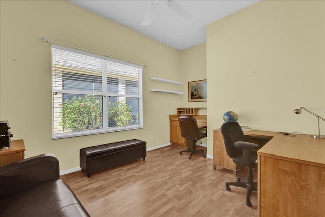 office area with plenty of natural light, ceiling fan, and light wood-type flooring