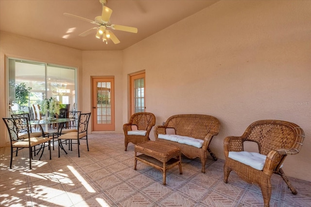 living area with ceiling fan