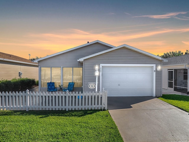 409 Rose Croft Ter, The Villages, FL 32162 - view of front of property with a garage and a yard