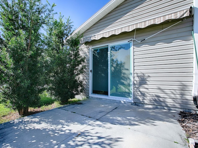 view of property exterior with a patio