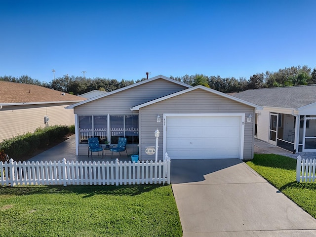 ranch-style house with a garage, a front lawn, and a sunroom