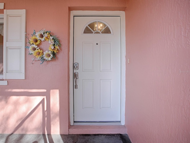 33236 Grand Cypress Way, Leesburg, FL 34748 - view of exterior entry featuring stucco siding