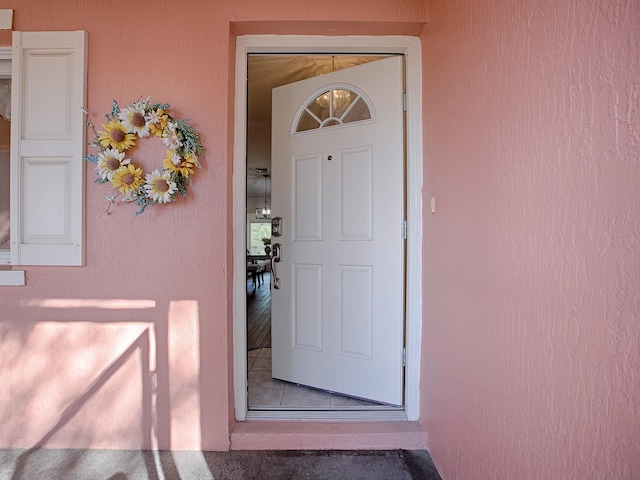 33236 Grand Cypress Way, Leesburg, FL 34748 - view of exterior entry with stucco siding