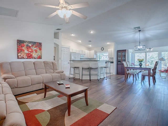 33236 Grand Cypress Way, Leesburg, FL 34748 - living area with light wood-style floors, ceiling fan, vaulted ceiling, and recessed lighting