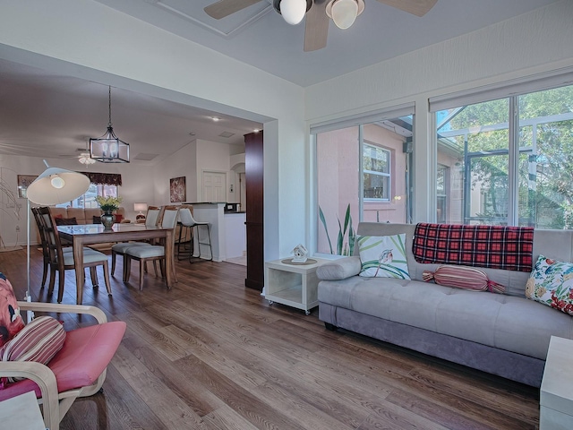 33236 Grand Cypress Way, Leesburg, FL 34748 - living area with a ceiling fan and wood finished floors