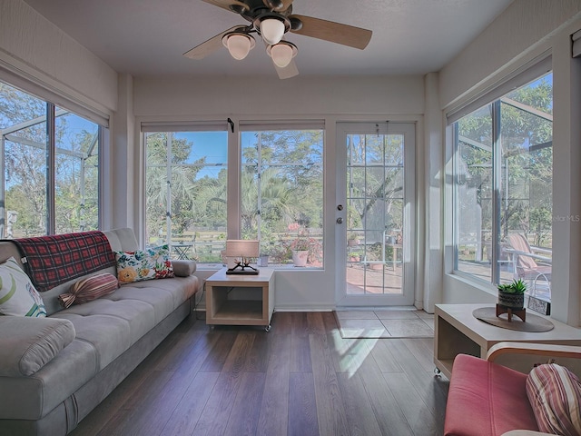 sunroom / solarium featuring ceiling fan