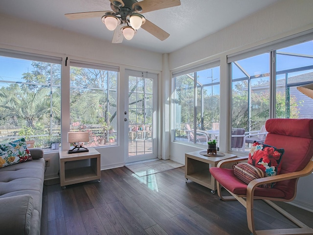 sunroom featuring ceiling fan