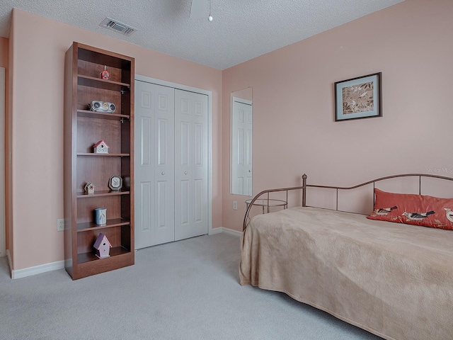 33236 Grand Cypress Way, Leesburg, FL 34748 - bedroom featuring carpet, baseboards, and a textured ceiling