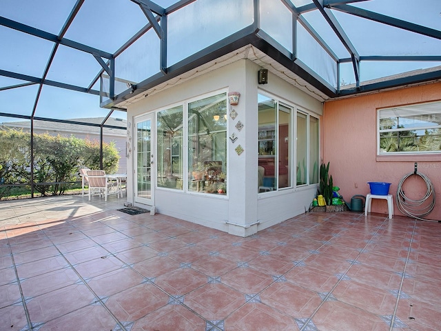 unfurnished sunroom with a wealth of natural light and vaulted ceiling