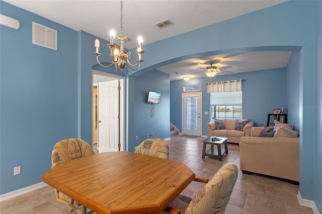 dining area with visible vents, baseboards, and stairs