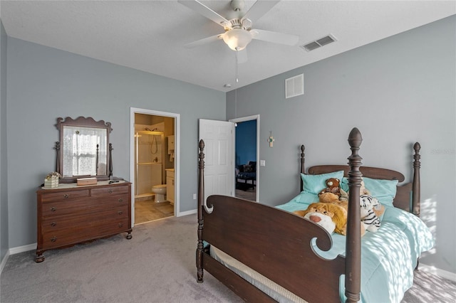 bedroom with ceiling fan, light colored carpet, visible vents, and baseboards