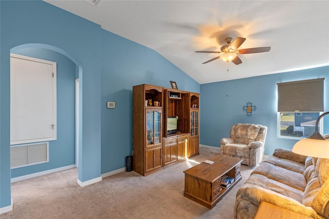 living room with ceiling fan, arched walkways, carpet floors, visible vents, and vaulted ceiling