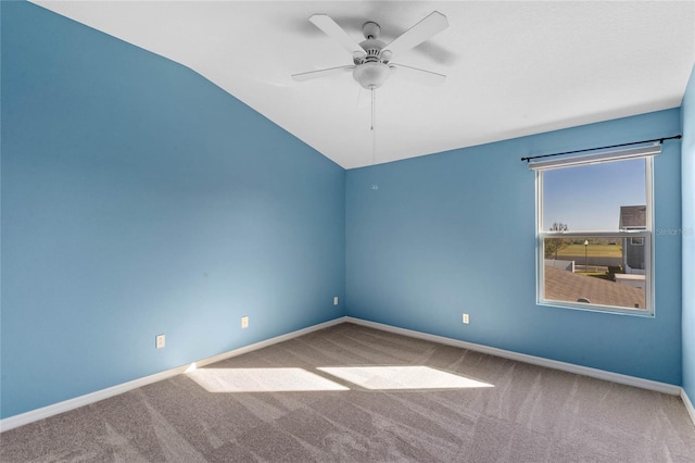 unfurnished room featuring carpet floors, a ceiling fan, and baseboards