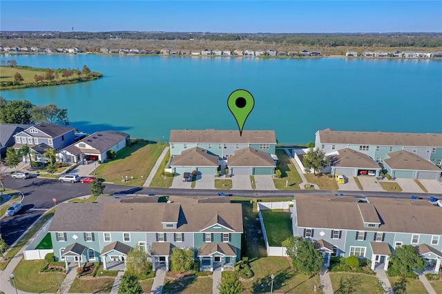 bird's eye view featuring a water view and a residential view