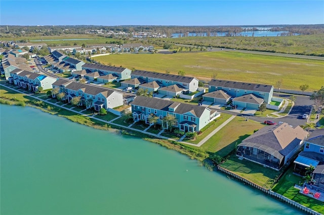 drone / aerial view with a residential view and a water view